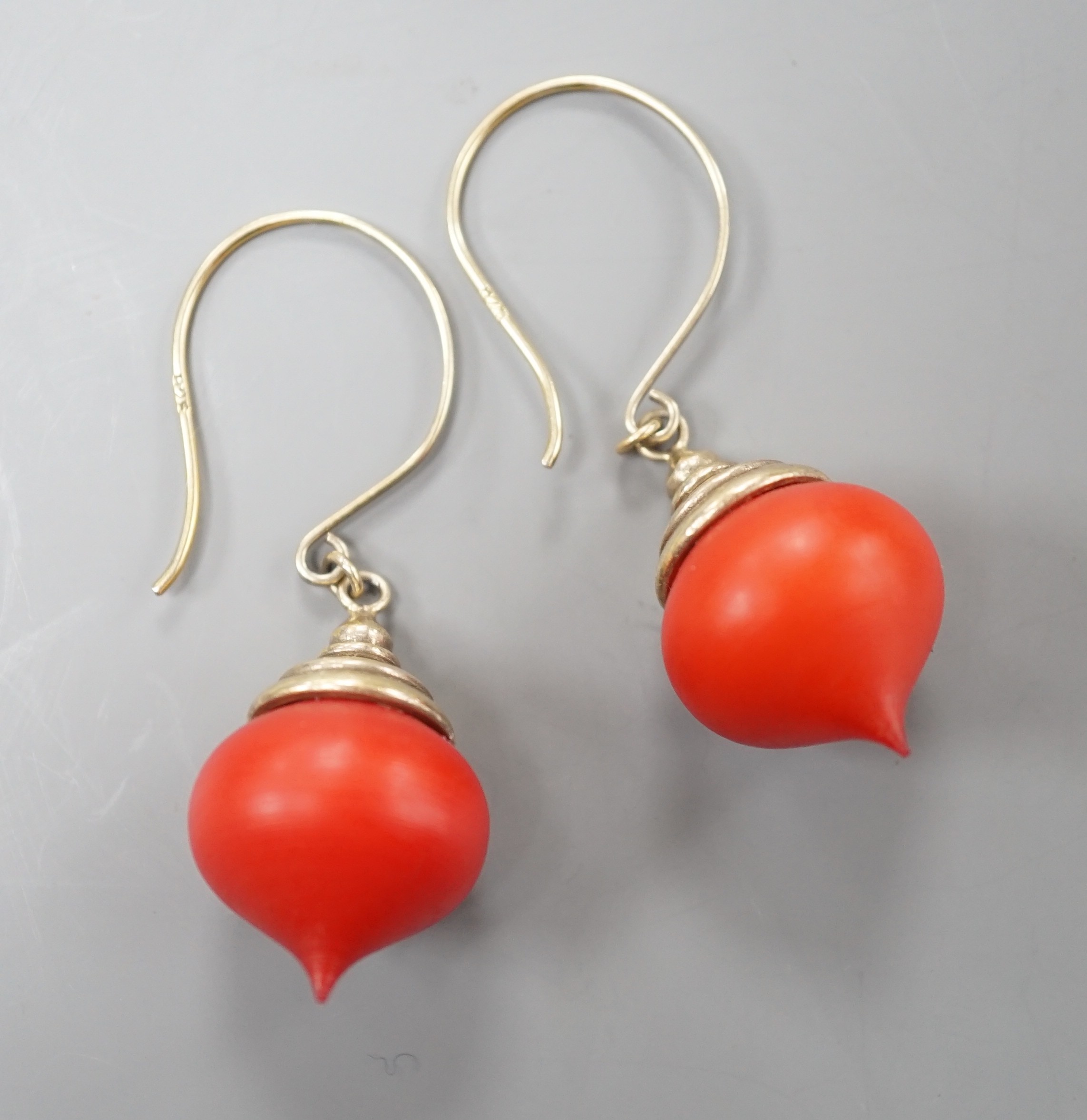 A pair of gilt white metal and stained wood drop earrings, 30mm.